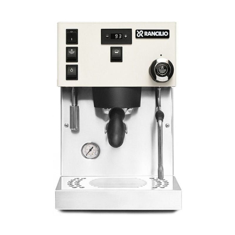 The Rancilio Silvia Pro X Dual Boiler, available in the sleek white Rancilio Stile Grinder Bundle, is an espresso machine ideal for professional baristas. It features a contemporary design with a digital temperature display, various control buttons on the left, a steam wand on the right, and a centered portafilter. A pressure gauge and drip tray are conveniently located at the bottom.