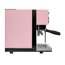 A side view of the Rancilio Silvia Pro X Dual Boiler Espresso Machine with PID in pink, showcasing black and silver accents. The machine features a portafilter handle, steam wand, and drip tray. Known for its minimalist modern design, it delivers professional performance in every brew.