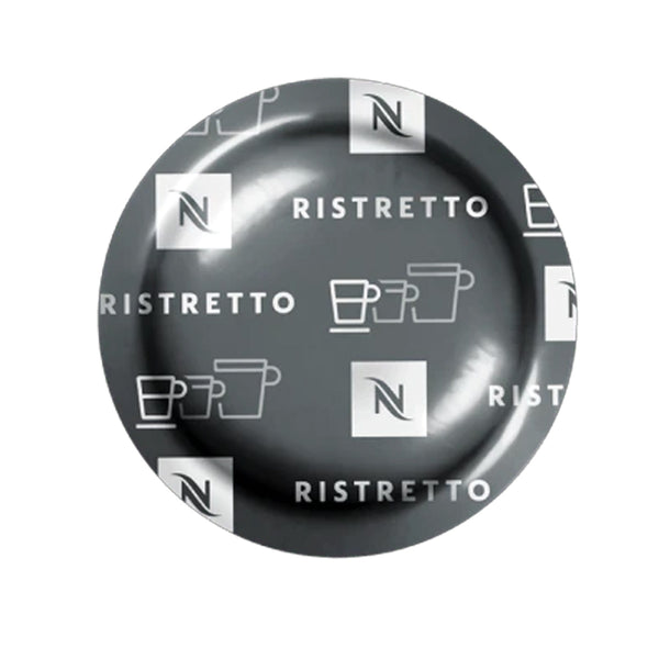 A Nespresso Ristretto Professional Capsule from the brand Nespresso, with sleek gray and white branding featuring the word "RISTRETTO" and outlined images of coffee cups. The shiny surface reflects light from above, enhancing its appearance. This intensely flavored coffee is made from a premium Arabica blend, ideal for a rich and flavorful experience.