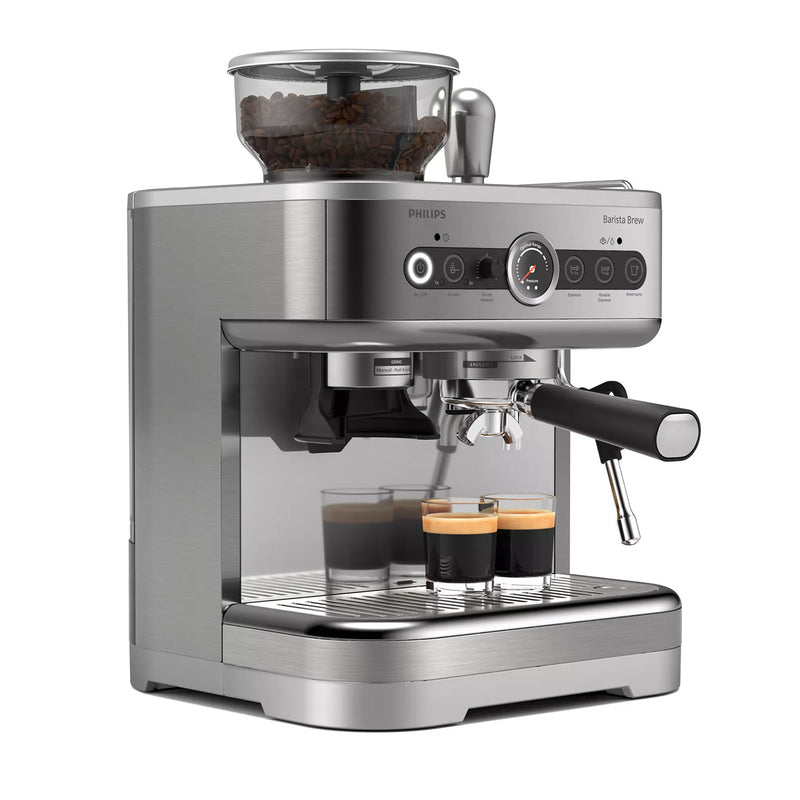 The Philips Barista Brew Semi Automatic Espresso Machine with Dual Bean Hopper PSA3228/01 (Silver) from Philips is a sleek, stainless steel machine featuring a built-in grinder that brews two shots of espresso. It includes knobs, buttons, and a digital display for various settings and adjustments. A transparent dual hopper container on top holds coffee beans, and it comes with a stainless steel portafilter.