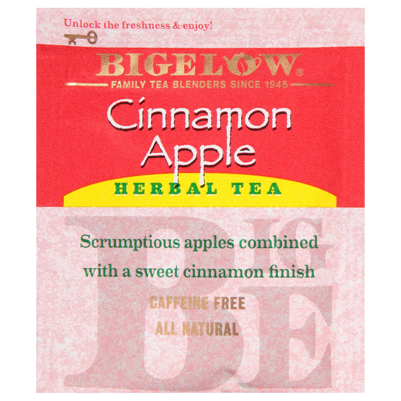 A packet of Bigelow Cinnamon Apple Tea Bags is shown, highlighting its caffeine-free and all-natural ingredients. The label describes the tea as "scrumptious apples combined with a sweet cinnamon finish." The background is red with brand details in gold. Perfect for those who enjoy natural fruit flavors.