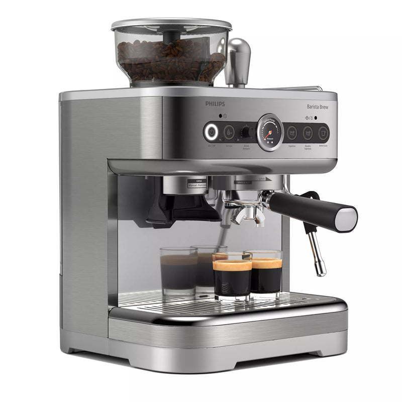 The Philips Barista Brew Semi Automatic Espresso Machine PSA3218/01 (Silver) is a sleek, stainless steel espresso machine featuring a dual bean container and built-in grinder. It includes a steam wand, a stainless steel portafilter holding two espresso cups, and various control knobs and buttons on the front panel.