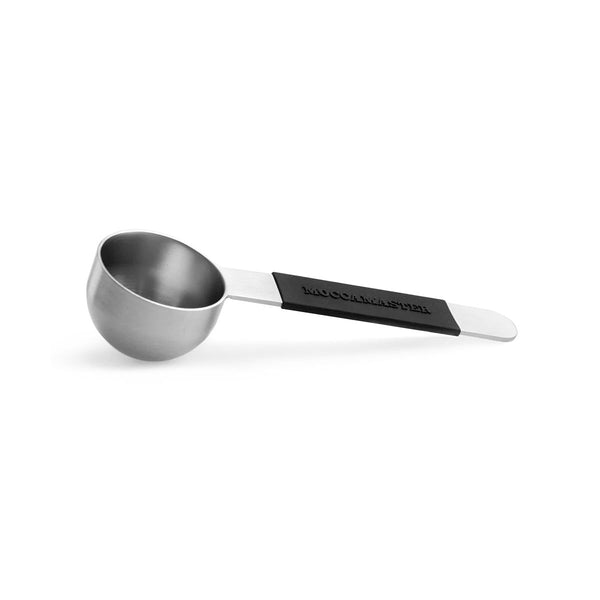 The Technivorm Moccamaster Stainless Steel Coffee Scoop MA004 features a black, rubberized handle with the word "MOCCAMASTER" engraved on it. The deep, round basin is perfect for measuring out coffee grounds, making this Moccamaster accessory essential for any coffee enthusiast.