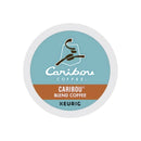 A Caribou Blend K-Cup® Recyclable Coffee Pod with a teal and white label features the Caribou Coffee logo, depicting a stylized caribou. The label reads "Caribou Coffee, Caribou Blend Coffee" in white and orange text, indicating it's a Medium Roast.