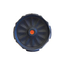 A top-down view of a Fellow Prismo Aeropress Coffee Maker Attachment by Fellow reveals its sleek, dark blue round mechanical dial with an orange button at the center. The streamlined design is complemented by a textured, grooved edge for easy grip and precise control.