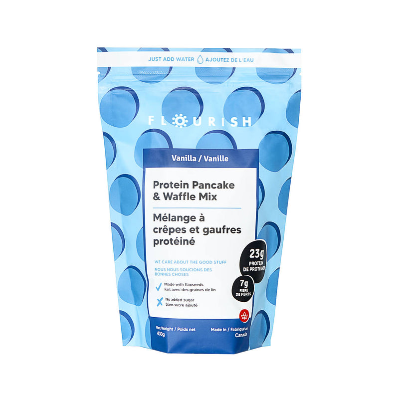 A resealable, blue bag of Flourish Vanilla Protein Pancake & Waffle Mix (Case of 8), made with non-GMO ingredients. The packaging states it includes 23 grams of protein and 7 grams of fiber per serving. The text is in both English and French. At the top, it reads "Just Add Water.