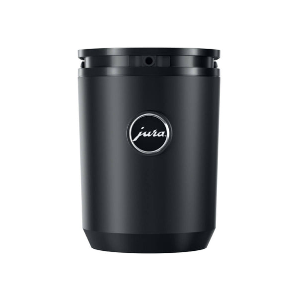 A sleek, black JURA Cool Control Milk Refrigerator Black 24283 (0.6 Lt / 20 oz) is shown against a white background. The cylindrical container has a smooth, matte finish with a glossy Jura logo at the center. The top features a recessed lid with a small opening, and the bottom slightly tapers inward, making it perfect for frothed coffee enthusiasts.