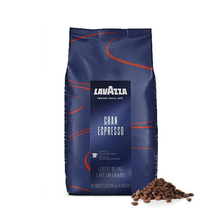 A dark blue bag of Lavazza Gran Espresso Espresso Coffee Beans (1kg / 2.2lb) is shown with a small pile of Lavazza beans next to it. The bag features red curved lines and the Lavazza logo, along with text describing the coffee's rich, intense flavor and dark roast.