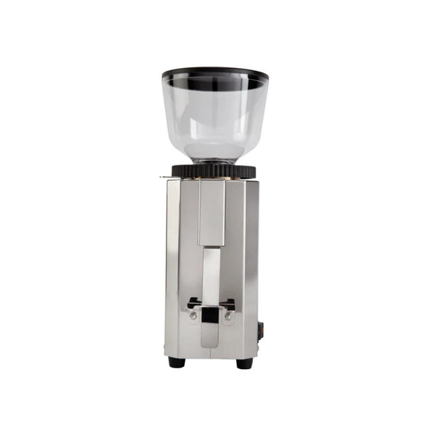 A front view of the Profitec Pro M54 Coffee Grinder by Profitec in silver, featuring a transparent bean hopper on top. The small grinder includes stepped setting controls, a rectangular stainless steel body, and two small black feet at the bottom for stability.